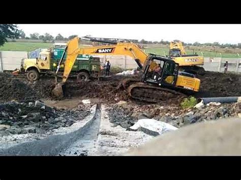 how to get a mini excavator unstuck out of mud|trackhoe mini diggers stuck.